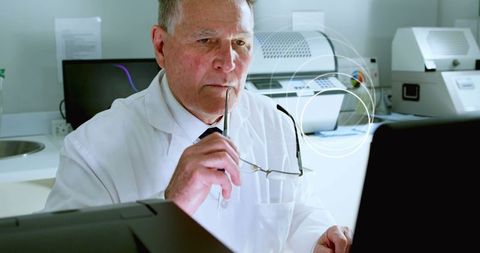 Senior Scientist Analyzing Data on Computer with Digital Effects - Download Free Stock Images Pikwizard.com