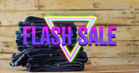 Stack of jeans with flash sale vivid neon sign