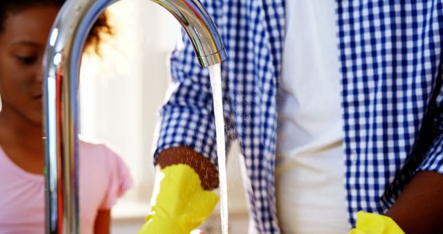 Father and Daughter Washing Hands with Running Water in Kitchen - Download Free Stock Images Pikwizard.com