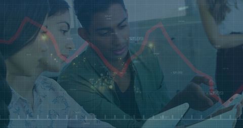 Diverse team analyzing data with dynamic digital overlay