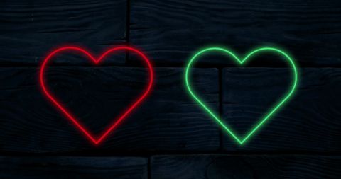 Red and Green Neon Hearts on Dark Wood Background - Download Free Stock Images Pikwizard.com