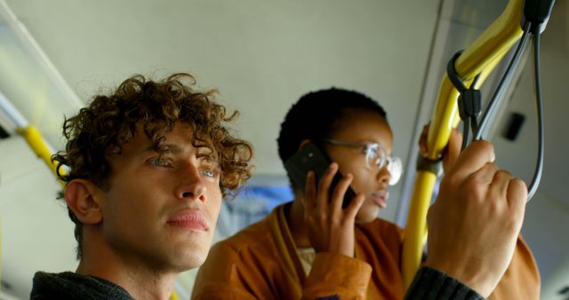 Young People Commuting by Public Transport Holding onto Handrails - Download Free Stock Images Pikwizard.com