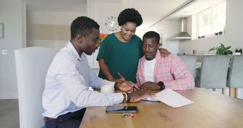 African American Friends Collaborating and Sharing Ideas at Home