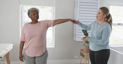 Female Physiotherapist Assisting Senior Woman During Rehab Exercise - Download Free Stock Images Pikwizard.com