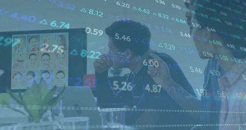 Business team analyzing stock market data on laptop and monitor with analytics overlay
