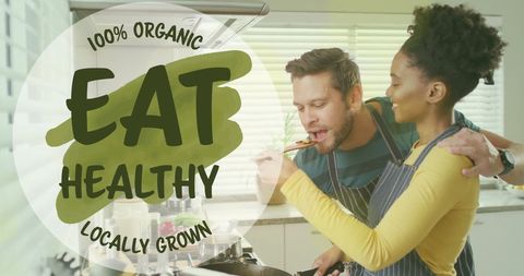 Happy Couple Cooking Healthy Organic Meal Together in Kitchen