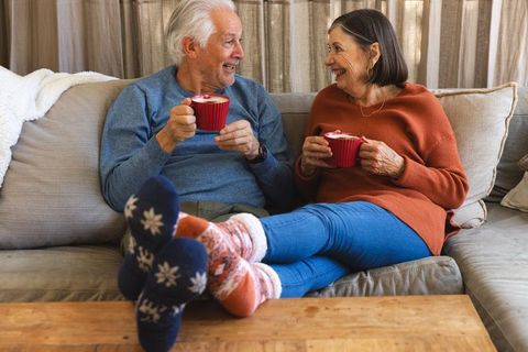 Senior Couple Enjoying Coffee in Cozy Living Room