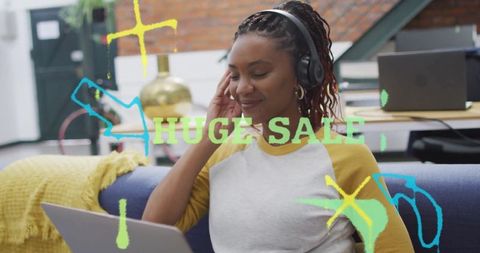 Smiling Woman Working on Laptop During Huge Sale