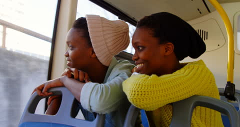 Smiling Twins Enjoy Bus Journey