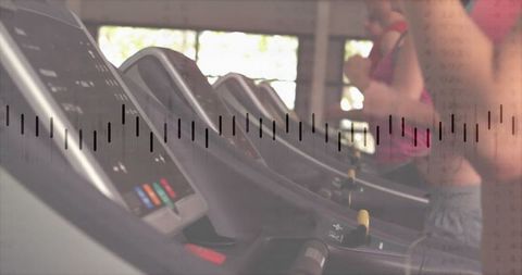 Women exercising on gym treadmills in modern fitness center