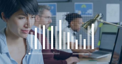 Diverse Professionals Analyzing Data in Office Environment