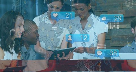 Diverse Team Collaborates with Tablet in Modern Tech-Driven Environment