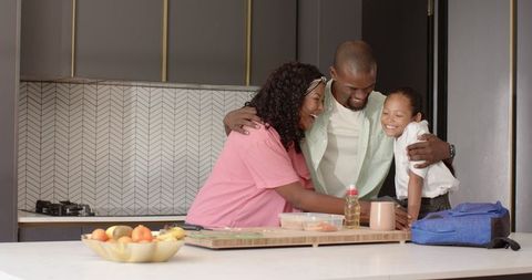 Loving family preparing lunch together in cozy kitchen