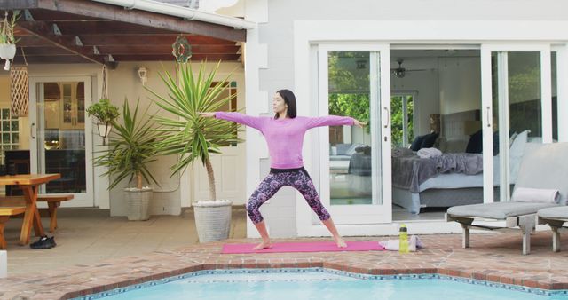 Biracial woman practicing yoga and stretching in garden. Beauty, health and female spa home concept.