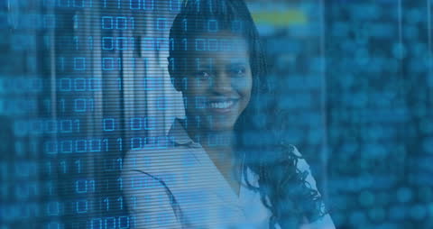 African American Woman Working in Data-Driven Environment