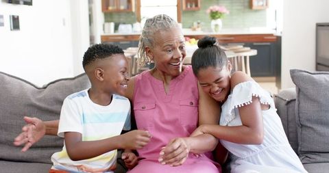 Joyful African American Grandmother Bonding with Grandchildren at Home
