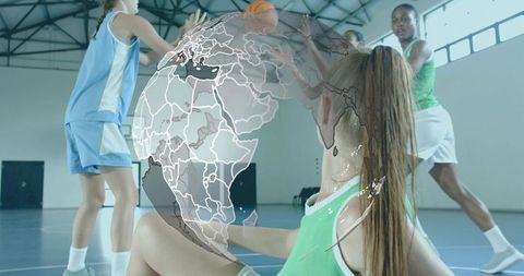 Female Basketball Players Competing and Reaching on Indoor Court with Globe Overlay