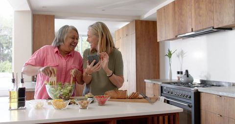 Happy Couple Cooking Together in a Modern Kitchen