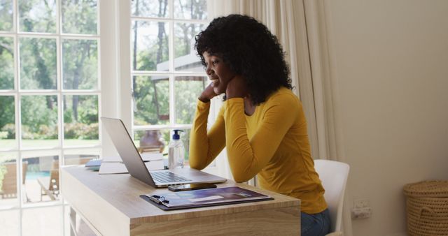 Woman Teleworking from Home Office Desk with Natural Light - Download Free Stock Images Pikwizard.com