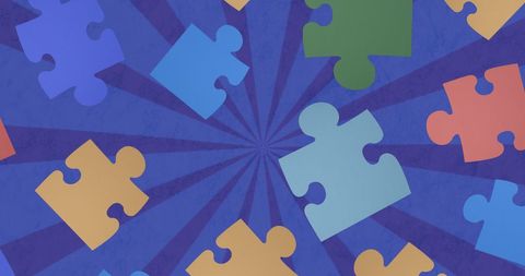 Colorful Puzzle Pieces on Starburst Blue Background for Creativity - Download Free Stock Images Pikwizard.com