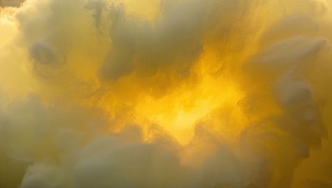 Radiating Golden Fibrous Cloud Glowing with Warm Backlight and Delicate Filaments