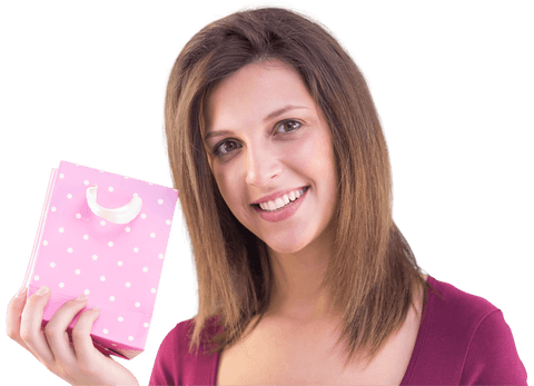 smiling young woman holding pink polka dot gift bag on transparent background - Download Free Stock Videos Pikwizard.com