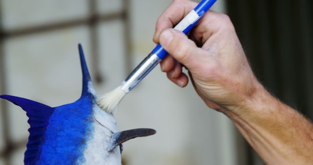 Hand Painting Blue Shark Model with Brush - Download Free Stock Images Pikwizard.com