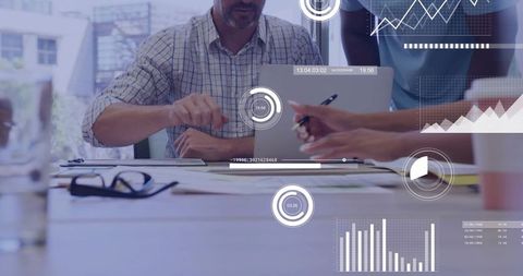 Team Collaborating Over Data Analytics with Laptop Documents Charts and Dashboard Overlays