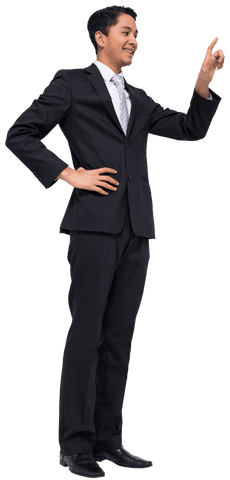 Happy asian businessman pointing upward on transparent background