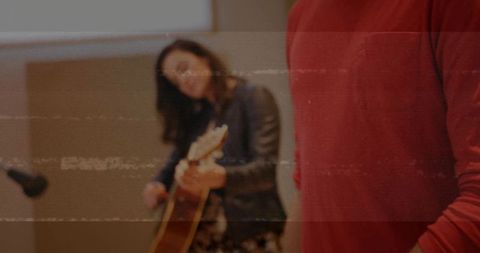 Guitarist in Studio Creating Live Music Atmosphere