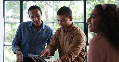 Diverse Colleagues Collaborating in Interactive Meeting Setting