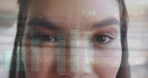 Close-up on Woman Engaging with Digital Financial Data Overlay