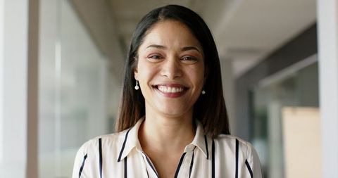 Smiling Professional Woman in Office Environment