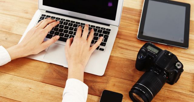 Photographer at Workspace with Laptop and Camera - Download Free Stock Images Pikwizard.com