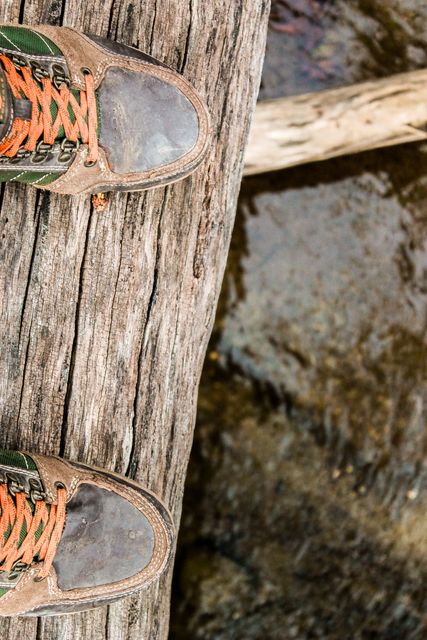 Hiking Boots on Weathered Wooden Plank - Download Free Stock Images Pikwizard.com