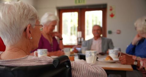 Senior Friends Enjoying Tea Gathering in Communal Setting - Download Free Stock Images Pikwizard.com