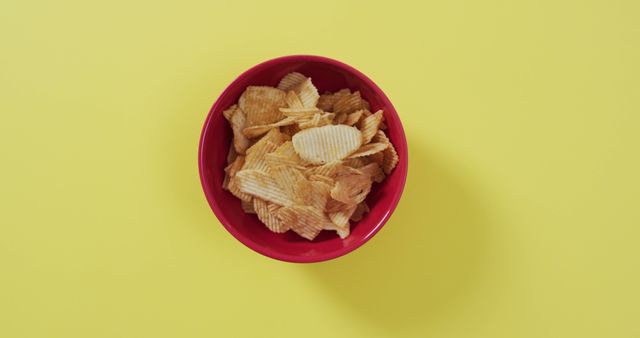 Red Bowl Filled with Potato Chips on Yellow Background - Download Free Stock Images Pikwizard.com