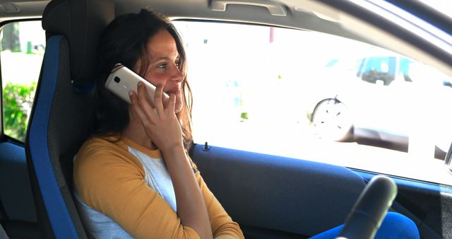 Woman Driving Using Smartphone in Modern Sedan - Download Free Stock Images Pikwizard.com