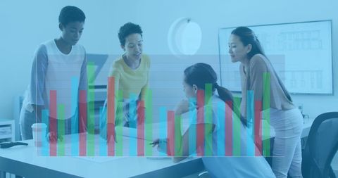 Diverse professionals analyzing business data in modern office