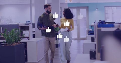 Collaborative teamwork with digital thumbs up in modern office