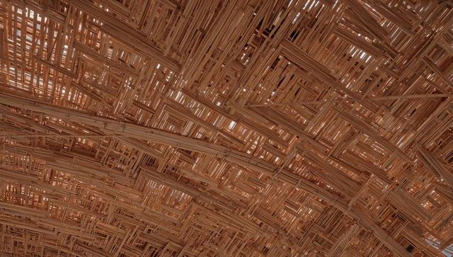 Curved Woven Wood Lattice Ceiling with Bamboo Slats and Organic Light Patterns