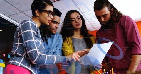 Diverse Team Collaborating on Business Analysis in Office