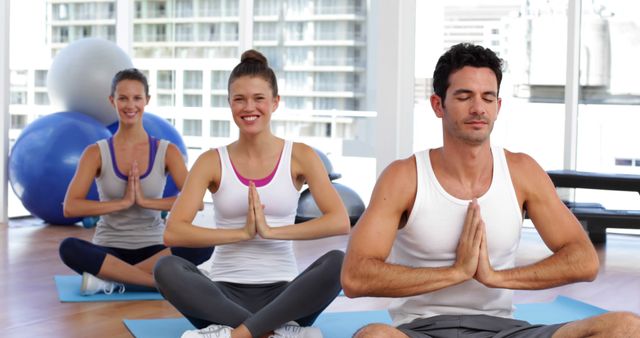 Group Yoga Session in Modern Gym with Happy Participants - Download Free Stock Images Pikwizard.com