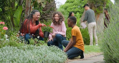 Joyful Multigenerational Family Gardening Together Outdoors