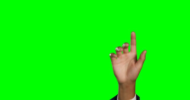 Businessman's hand raised and pointing up against a green screen background. Ideal for graphic designers, video editors, and content creators needing a hand gesture for use in presentations, animations, and promotional materials. The green screen background allows for easy keying to replace with other images or videos.