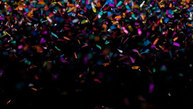 Colorful Confetti Storm Against Black Background