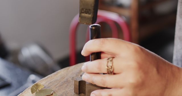 Craftsman Forming Metal Jewelry with Hammer in Workshop - Download Free Stock Images Pikwizard.com