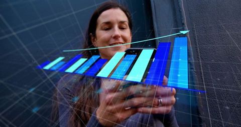 Business Analyst Viewing Digital Bar Chart with Growth Arrows