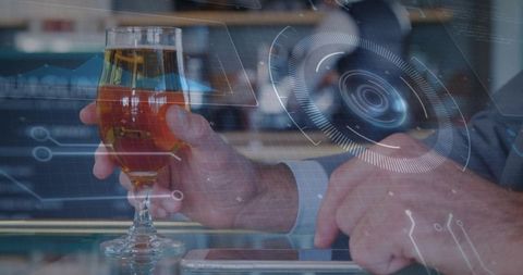 Business Casual Man Holding Beer Glass and Tapping Smartphone with Futuristic HUD Overlay