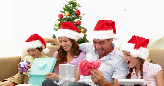 Happy Family Unwrapping Christmas Presents at Home - Download Free Stock Images Pikwizard.com